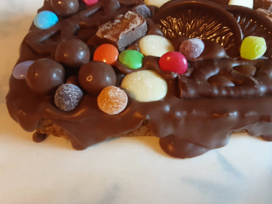 Belgian Milk Chocolate Flapjack Slab with Chocolate and Jelly Sweets.