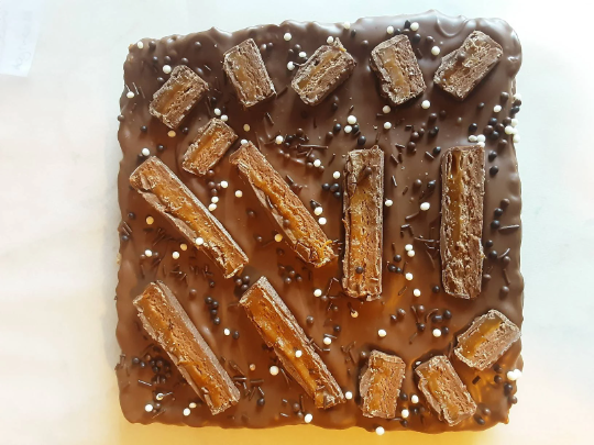 Mars Bar Rice Krispie Slab topped with Belgian Milk Chocolate.