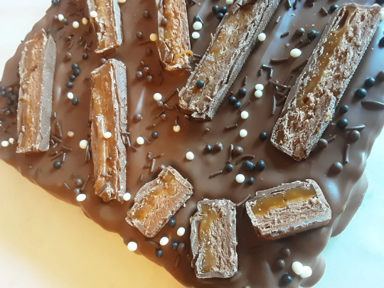 Mars Bar Rice Krispie Slab topped with Belgian Milk Chocolate.