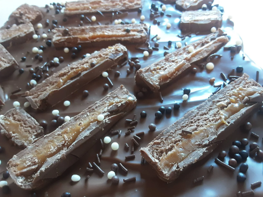 Mars Bar Rice Krispie Slab topped with Belgian Milk Chocolate.